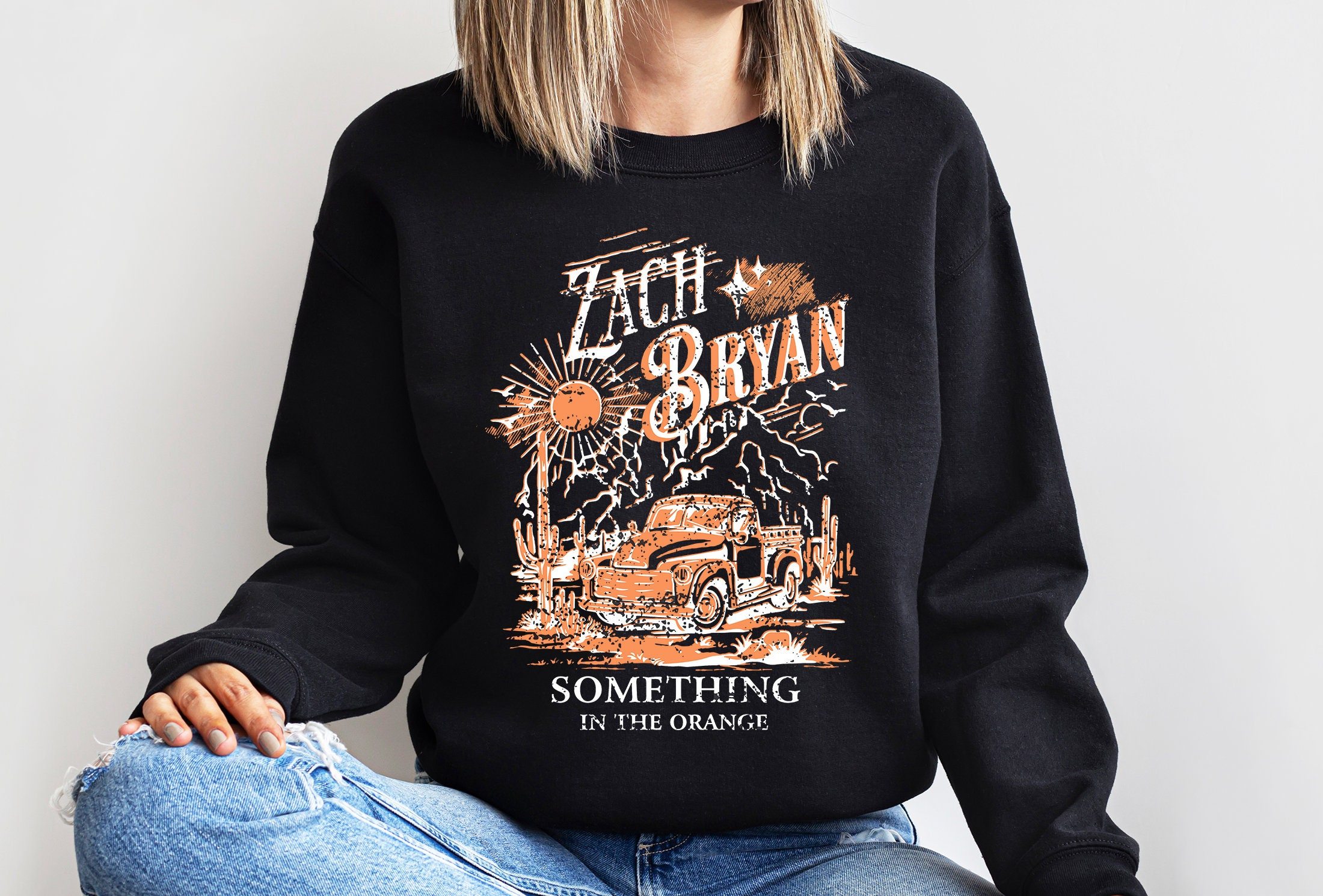 Zach bryan something in the orange sweatshirt